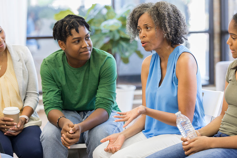 group of people sitting and talking